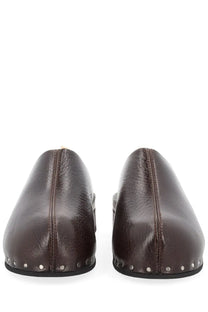 Brown leather mules with silver studs along the sole from Our Legacy women’s sandal naoto black collection
