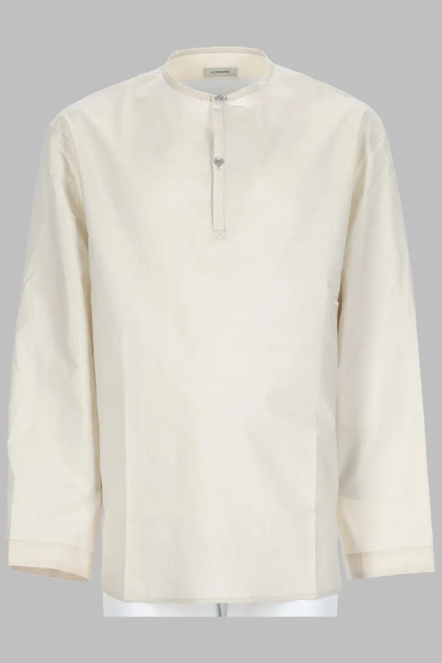 Cream-colored long-sleeved men’s shirt with stand-up collar and front button closure by lemaire