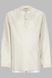 Cream-colored long-sleeved men’s shirt with stand-up collar and front button closure by lemaire