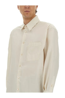 A crisp off-white lemaire men’s long-sleeved cotton and silk button-down shirt with collar and chest pocket