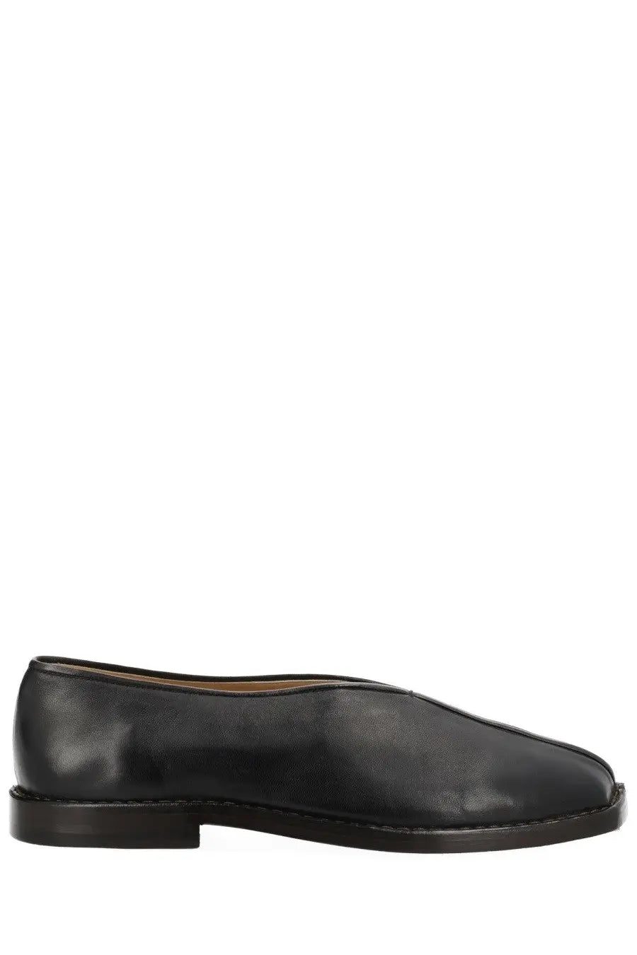 Lemaire men’s black leather slip-on loafer with low block heel and minimalist flat piped slipper design