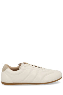 Lemaire men’s soft runner sneaker in cream leather with beige accents and tan rubber sole low-top design