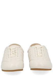 Lemaire men’s soft runner sneaker in white leather with beige laces and tan rubber sole for casual wear