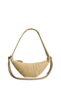 Beige leather crescent-shaped crossbody bag with braided rope strap and quilted texture from lemaire