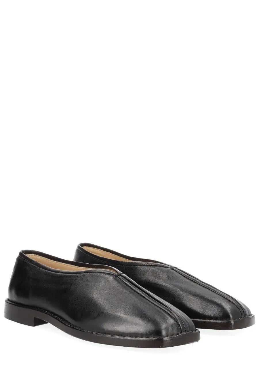 Lemaire women’s black leather flat piped slipper with sleek minimalist design and subtle stitching details