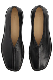 Lemaire women’s flat piped slipper black made of black leather with sleek minimalist design and subtle stitching details