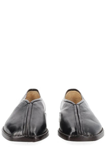 Lemaire women’s black leather slip-on flat piped slippers with sleek minimalist design and subtle stitching details