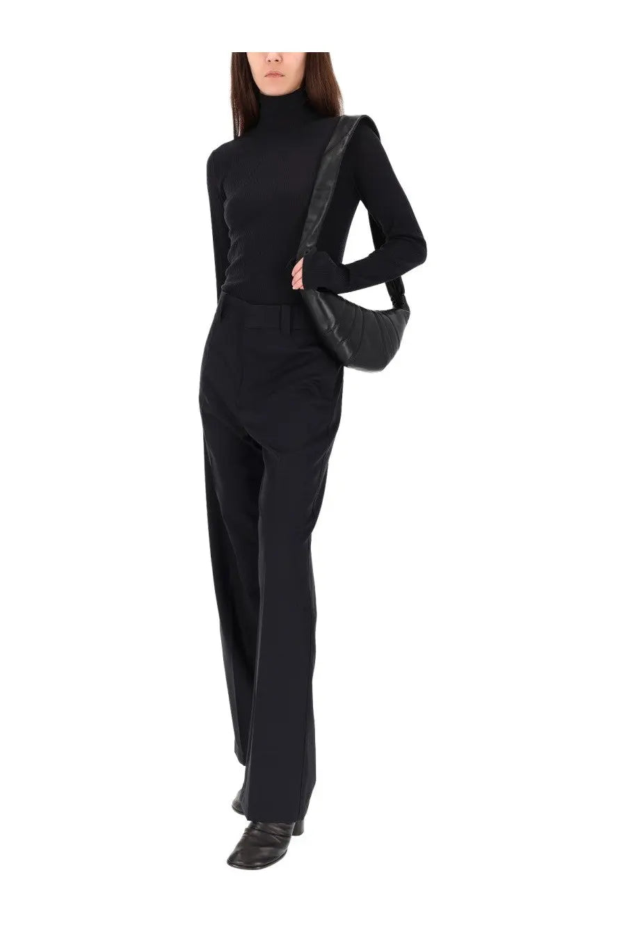 Black quilted leather shoulder bag paired with lemaire women’s blue straight pants for a stylish look