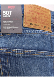 Levi’s men’s blue denim jeans with a brown leather patch and black tag featuring the 501 loose model back view