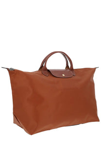 Longchamp women’s brown leather-trimmed le pliage original tote bag with minimalist design and foldable structure