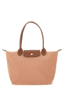 Beige longchamp le pliage tote bag with brown leather handles and gold-tone clasp in medium blue collection