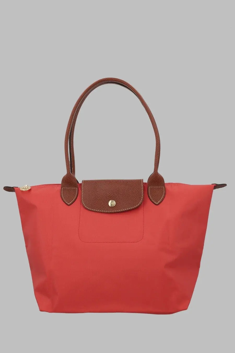 Red longchamp le pliage tote bag with brown leather handles and flap in medium blue for women