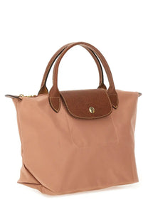 Longchamp women’s le pliage small tote bag in tan with brown leather handles and textured flap closure