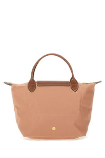 Tan longchamp le pliage tote bag with brown leather handles and gold-tone hardware in a blue small size design
