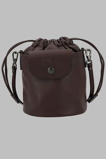 Longchamp womens brown leather bucket bag with drawstring top and adjustable shoulder strap in extra small size