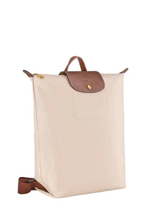 Beige longchamp le pliage backpack with brown leather accents and gold-tone hardware for women