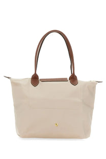 Beige longchamp le pliage tote bag with brown leather handles and trim for women medium pink edition