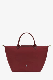 Longchamp women’s le pliage nylon tote bag in burgundy with top handles and metallic logo plaque