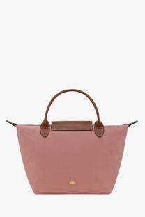 Longchamp women’s le pliage original nylon tote bag in soft pink with brown leather handles and gold-tone clasp