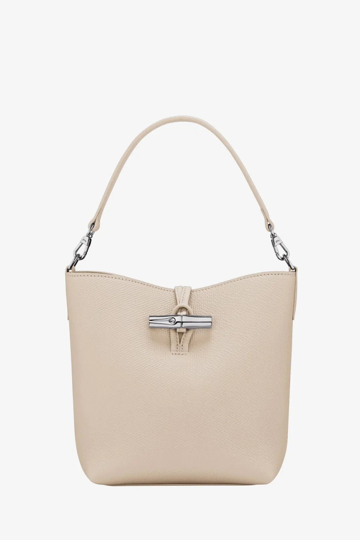 Longchamp women’s le roseau beige leather bucket bag with silver-tone clasp and matching handle in white background