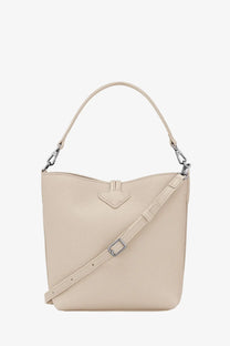 Longchamp women’s le roseau beige textured leather bucket bag with adjustable strap and silver-toned hardware