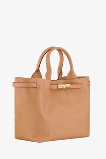 Beige leather tote bag with gold-tone buckle and matching handles from Longchamp women’s Le Roseau collection
