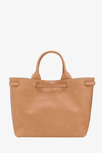 Tan leather tote bag with top handles and central strap detail from longchamp women’s le roseau leather handbag green collection