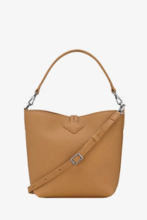 Longchamp women’s le roseau xs leather bucket bag in brown tan with textured surface silver hardware and adjustable strap