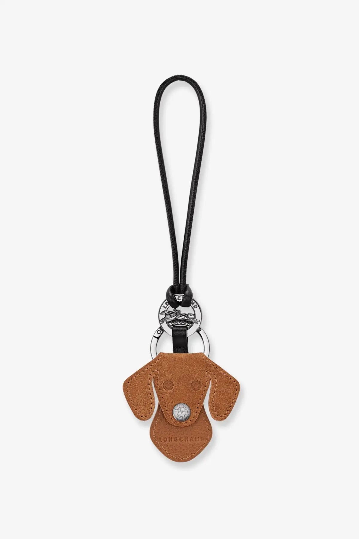 Longchamp women’s leather llaveros keychain white featuring a tan leather dog shape with silver button nose and black cord loop