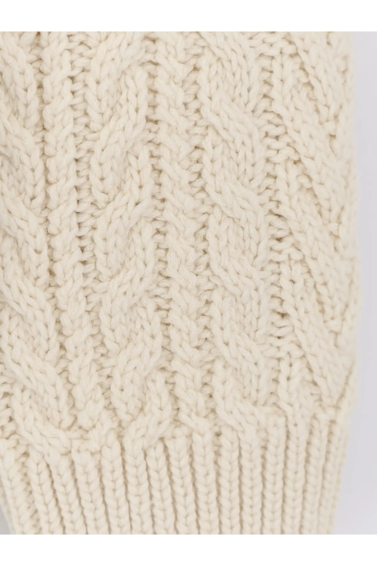Cream-colored cable-knit sleeve of Loro Piana men’s schooner sweater in beige cashmere and abaca blend