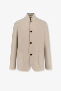 Beige wool blend blazer with mandarin collar and dark brown buttons from Loro Piana men’s Spagna linen blazer orange collection