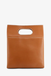 Tan leather tote bag with minimalist oval handle cutout and white stitching by Loro Piana women’s just bag tart