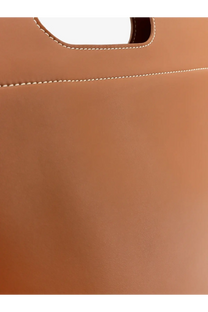 Tan leather tote bag with contrasting white stitching along handle and seams from Loro Piana Women’s Just Bag TART