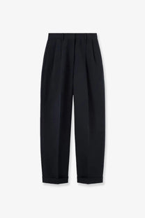 Black pleated tailored trousers with rolled cuffs styled for a sophisticated look in linen and cotton blend