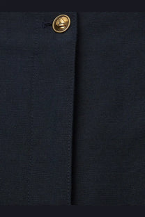 Dark navy textured fabric with gold-toned sailboat button on loro piana women’s kenith linen and cotton trousers blue