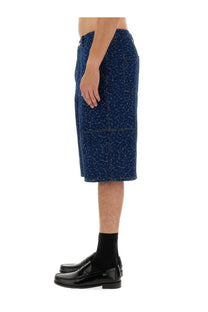 Maison Kitsuné men’s dark blue denim bermuda shorts with subtle white abstract pattern and visible stitching