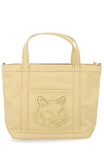 Beige canvas Maison Kitsune women’s borsa tote bag featuring an embroidered fox face on the front