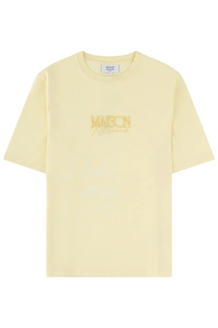 A pale yellow Maison Kitsuné women’s shirt with a subtle gold embroidered logo across the chest
