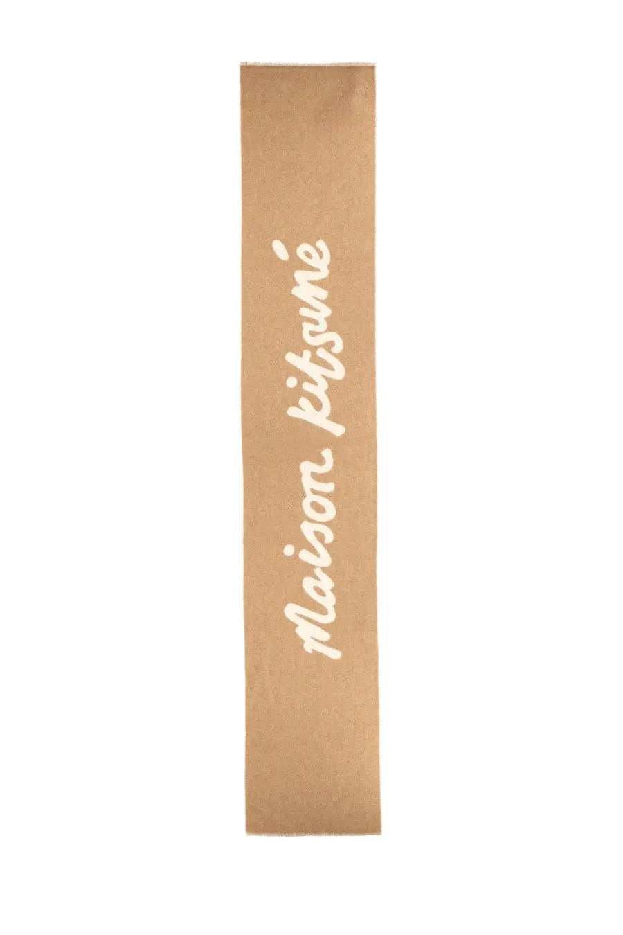 A brown paper sleeve with maison kitsuné in white cursive on a beige wool scarf for women
