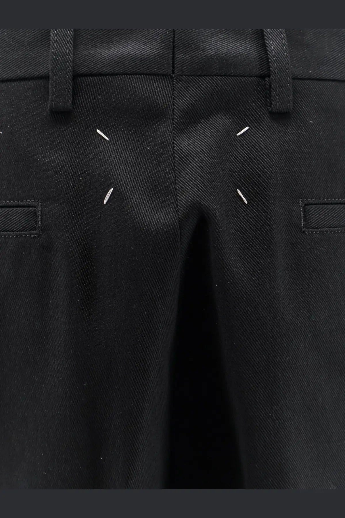 Maison Margiela men’s black cotton blend bermuda shorts with distinctive white stitching accents on tailored design