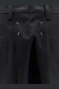 Maison Margiela men’s black cotton blend bermuda shorts with distinctive white stitching accents on tailored design