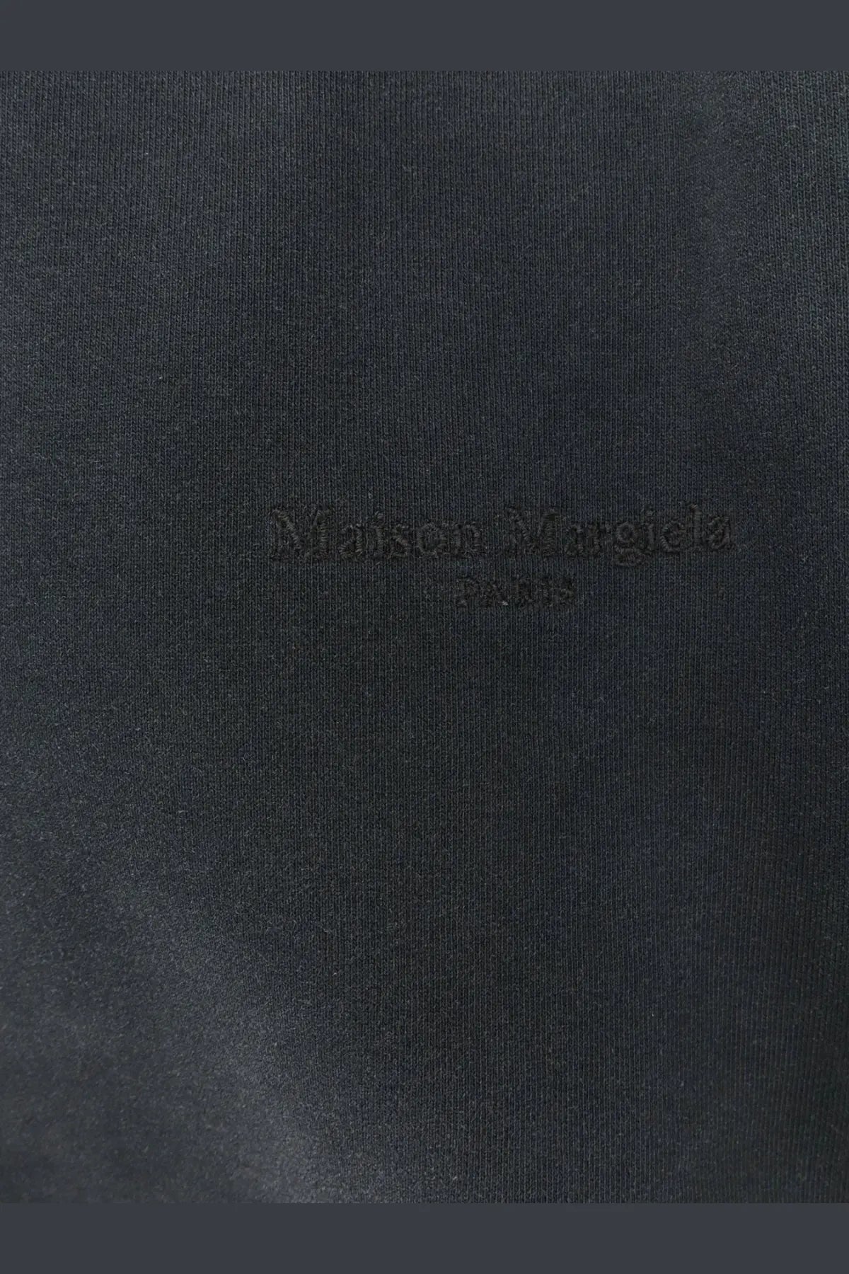 Maison Margiela men’s grey cotton sweatshirt with black embroidered Paris logo on dark fabric detail