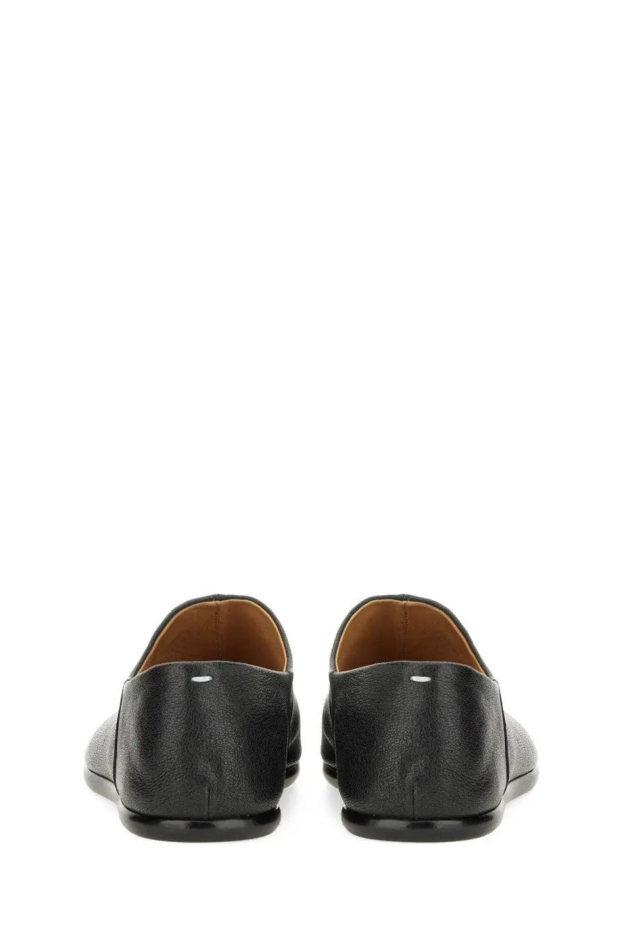 Maison Margiela men’s black leather tabi mules with subtle texture and tan lining for stylish comfort