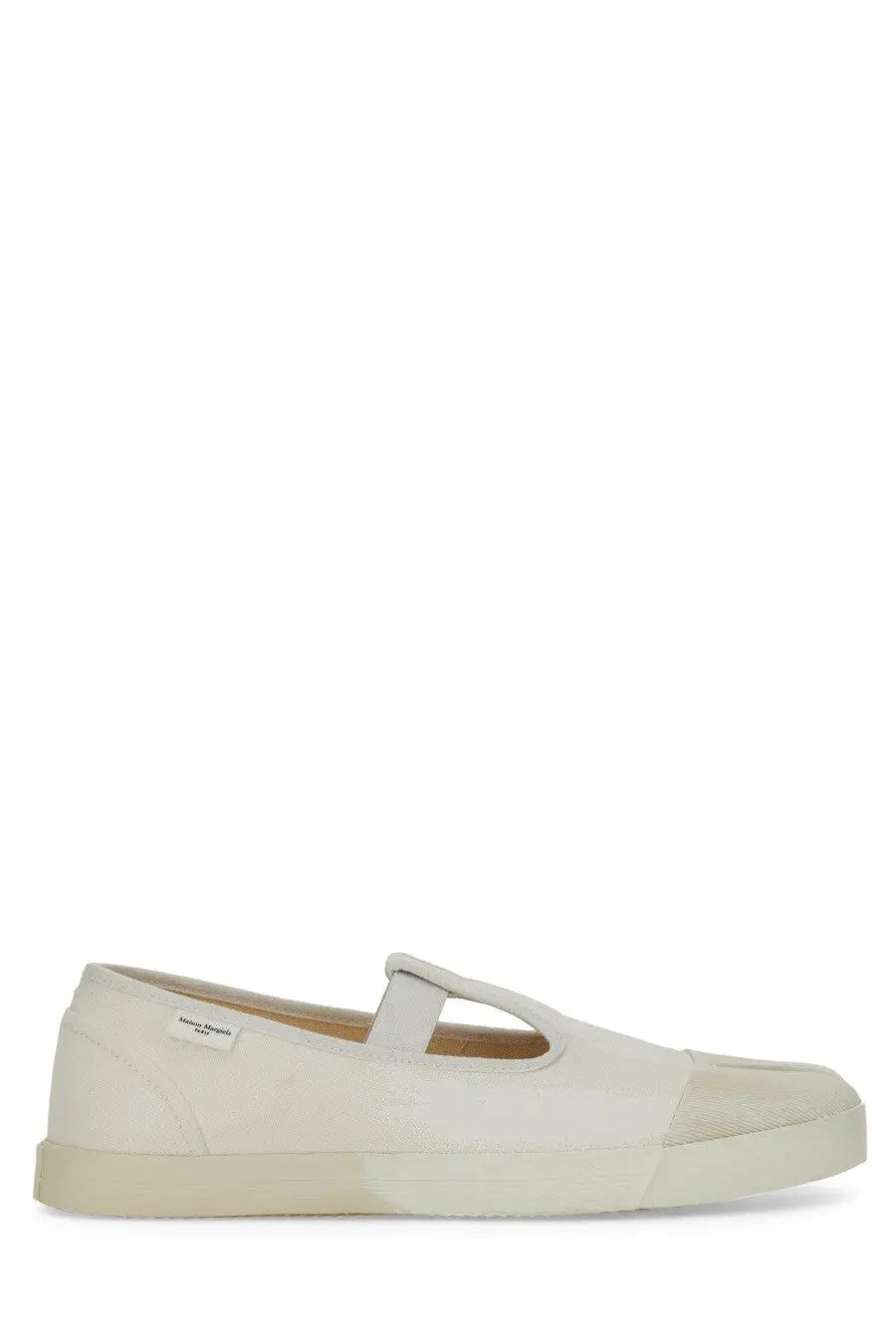 Maison margiela men’s mary jane tabi slip-on shoe in cream canvas with minimalist design and rubber sole