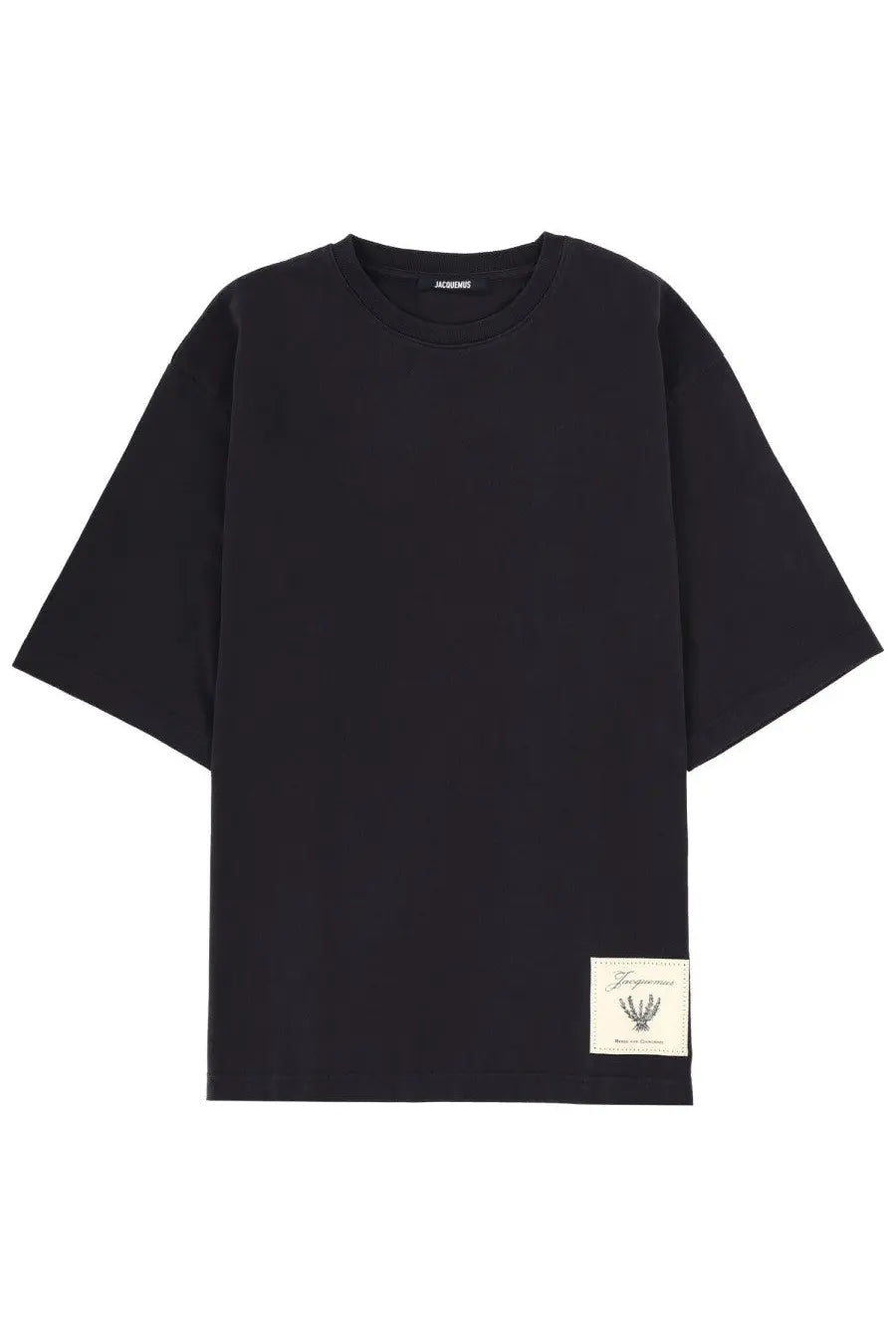 Black oversized crewneck t-shirt with cream-colored embroidered patch and Maison Margiela men’s silver necklace