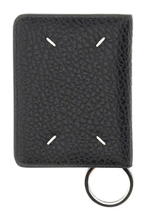 Maison Margiela men’s black textured leather bifold wallet with white stitching and metal key ring