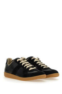 Maison Margiela men’s replica sneaker black with black matte finish cream laces and tan rubber sole visible from the back