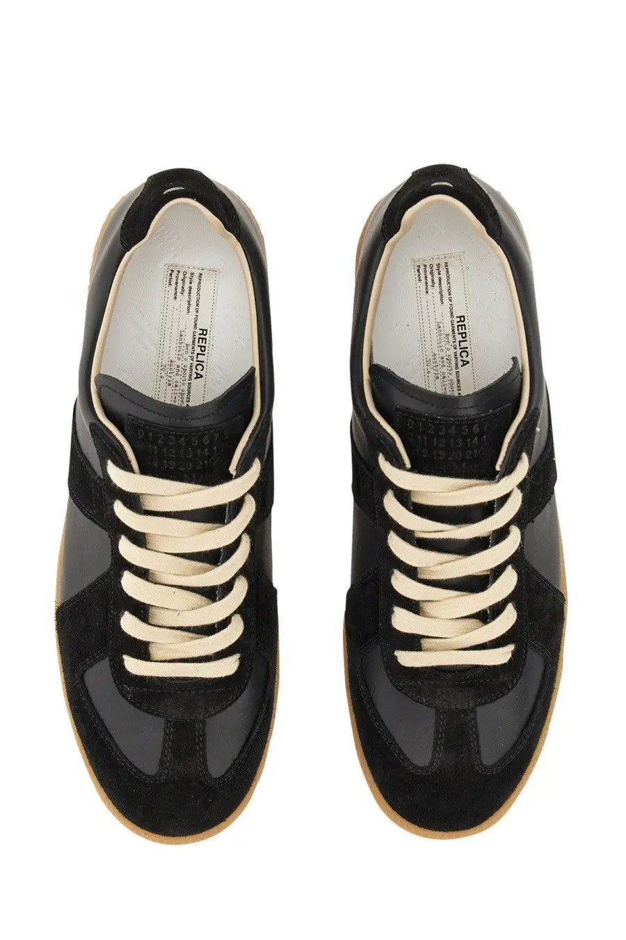 Maison Margiela men’s replica sneaker in black suede and leather with cream laces and classic low-top design