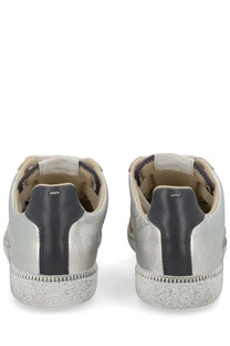 Maison Margiela men’s replica sneakers in silver and black leather with a textured rubber sole