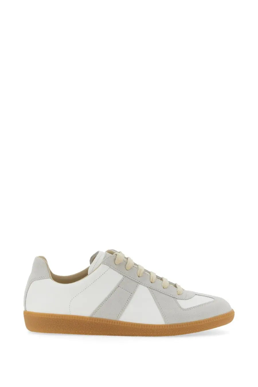 White and light gray suede sneaker with a tan rubber sole.